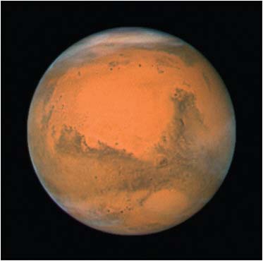FIGURE 6.18 NASA’s Hubble Space Telescope took this closeup of Mars when it was just 55 million miles away on December 18, 2007. SOURCE: Courtesy of NASA, ESA, the Hubble Heritage Team (STScI/AURA), J. Bell (Cornell University), and M. Wolff (Space Science Institute, Boulder).
