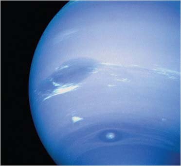 FIGURE 7.10 Neptune. The Great Dark Spot is a large storm that has now disappeared. Clouds of methane ice revealed the fastest winds in the solar system. SOURCE: Courtesy of NASA/JPL.