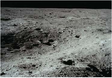 FIGURE 3.9 The Moon has a unique ability to record history. The lunar surface may harbor meteorites from Earth’s first billion years, transported to the Moon by large impacts. The lunar soil contains embedded solar wind particles; the ancient stratigraphic record exposed on the Moon may reveal a history of the luminosity and state of the Sun over time. SOURCE: Courtesy of NASA.
