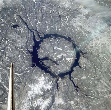 FIGURE 4.15 Manicouagan impact crater in winter. NASA Photo ID: ISS004-E-10763. SOURCE: Courtesy of the Image Science and Analysis Laboratory, NASA Johnson Space Center. Available at http://eol.jsc.nasa.gov.