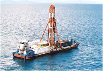 FIGURE 4.4 The drilling barge Viphya on Lake Malawi, East Africa in March 2005. Twenty-five scientists, drillers and mariners lived and worked aboard the vessel for 35 days, recovering long, continuous records from two sites in the lake–the longest a 385-m core from 600-m water depth (Scholz et al., 2006). SOURCE: Photograph courtesy of Jason Agnich.