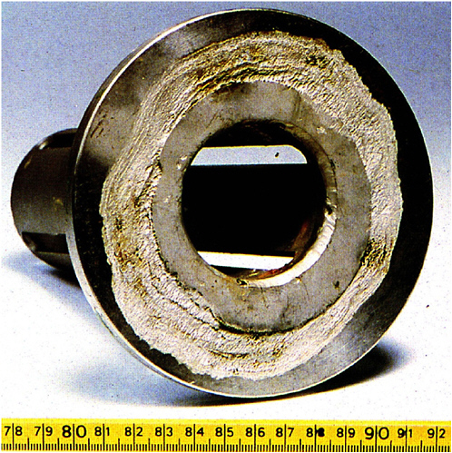 FIGURE 3.7 Crevice corrosion of a corrosion-resistant alloy flange. SOURCE: Corrosion Atlas (E.D.D. During, ed.) 1997, copyright 1997, Elsevier.