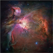 FIGURE 2.4.3 Hubble Space Telescope image of the Orion Nebula. This is a nearby region in the Milky Way galaxy where new stars are forming out of a surrounding gas cloud. Intense radiation from these young stars is causing the natal gas clouds to glow in a swirl of vibrant colors. SOURCE: NASA, ESA, M. Robberto (STScI/ESA), and the Hubble Space Telescope Orion Treasury Project Team.