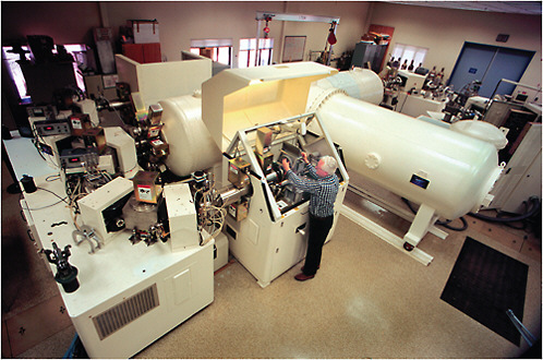 Photograph of Bob Schneider loading samples into the tandetron accelerator ca 1997. SOURCE: Tom Kleindinst, Woods Hole Oceanographic Institution.
