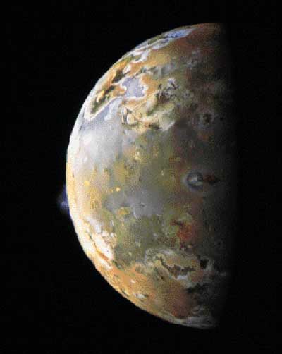 Contributing to the constant emission of sulfurous gas that fuels a powerful electrical circuit between Jupiter  and its volcanic moon, two sulfurous eruptions are visible on io  in this color composite image from the Galileo spacecraft. On the far left, a bluish plume rises about 85 miles above the surface of a volcanic caldera called Pillan Patera. In the middle of the image, near the day/night shadow line, the ring-shaped Prometheus plume rises 45 miles above io  and casts a shadow to the right of the volcanic vent. The Prometheus plume has been visible in every image made of this region, dating back to the Voyager flybys of 1979, raising the possibility that this volcano has been continuously active for at least 20 years.