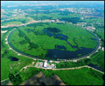 A circular course 1.3 miles across marks the enormous underground Tevatron accelerator at Fermi National Accelerator Laboratory near Chicago.