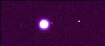 Callisto (far right) orbits about four times farther from Jupiter than does Io (near right), the nearest Galilean moon.